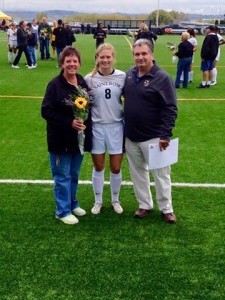 Morgan (center) with her parents Shelly (left) and Bruce Burchhardt (right)