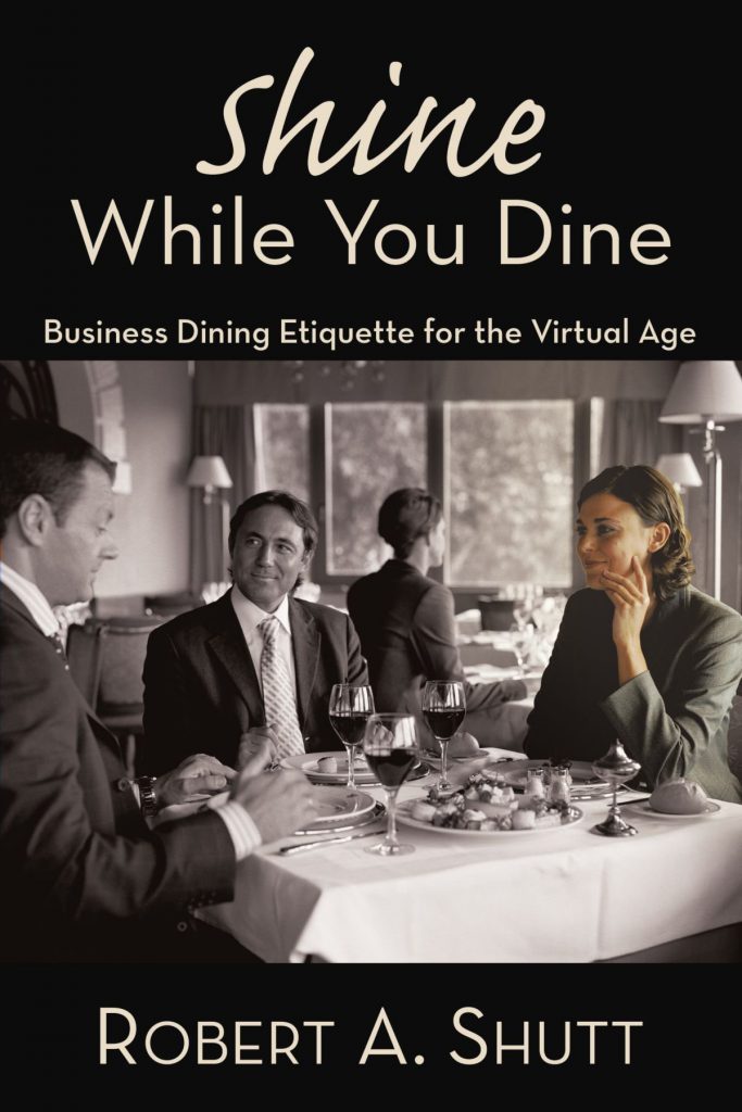 Book cover for "Shine While You Dine," a business etiquette book.