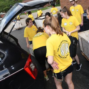 Students unpacking a car at Saint Rose on move-in day in Fall 2017.