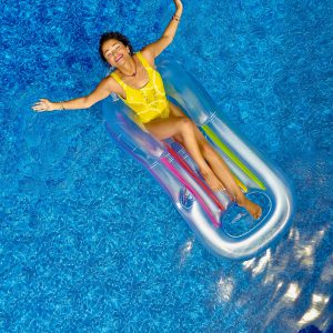 woman on pool float in pool